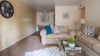 Cantera living room with couches and carpet floors